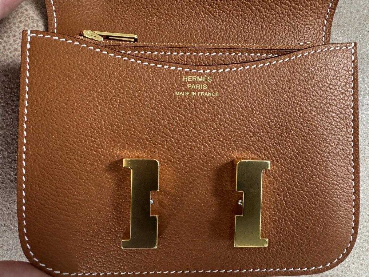 Hermès gold with gold hardware Constance slim wallet