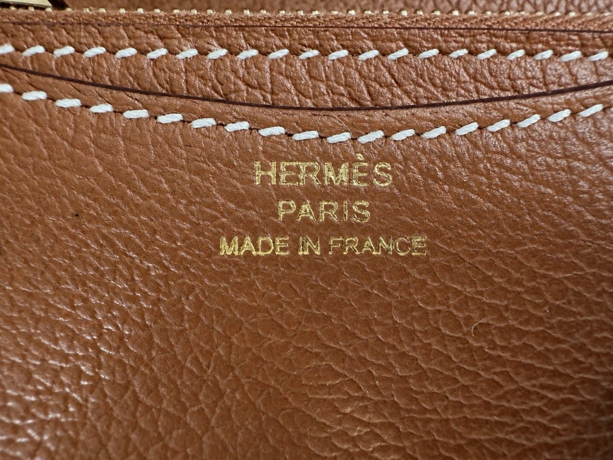 Hermès gold with gold hardware Constance slim wallet
