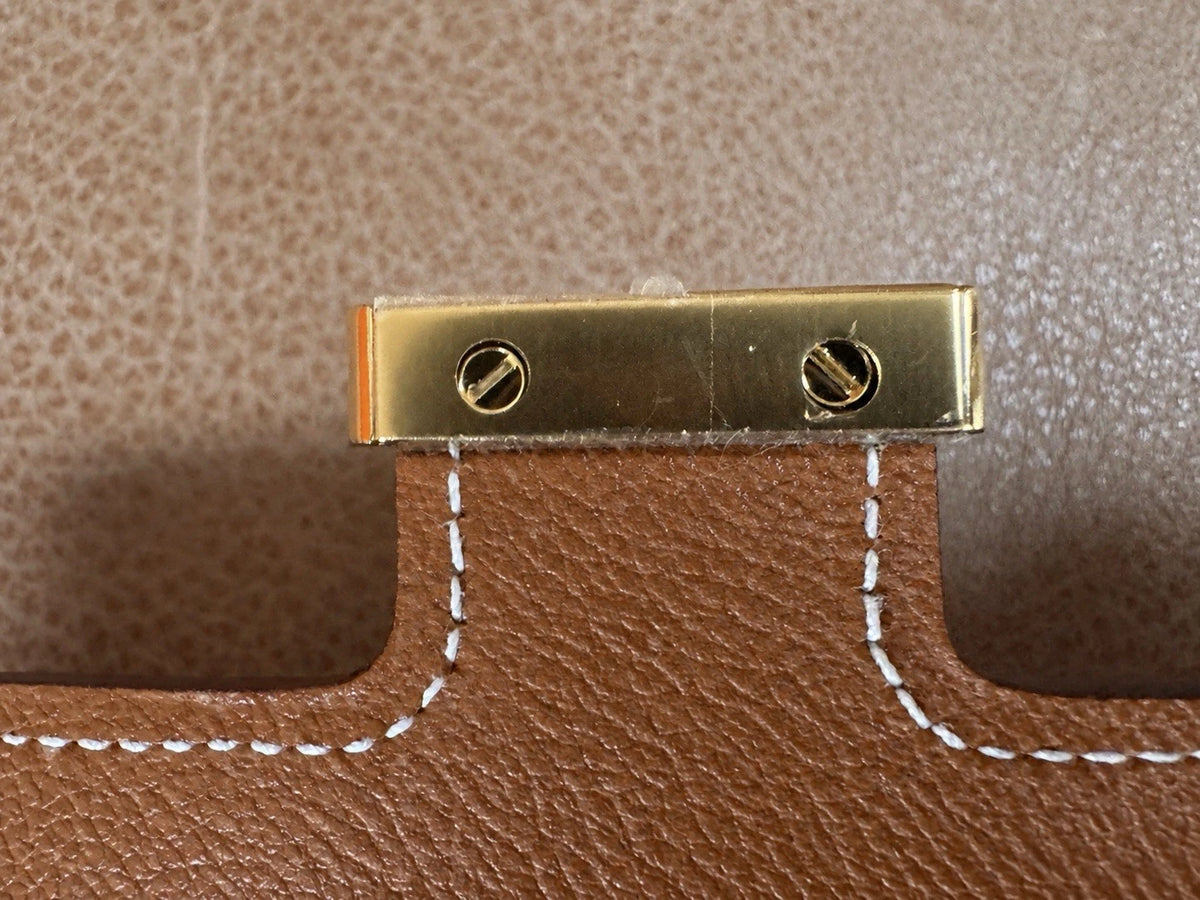 Hermès gold with gold hardware Constance slim wallet