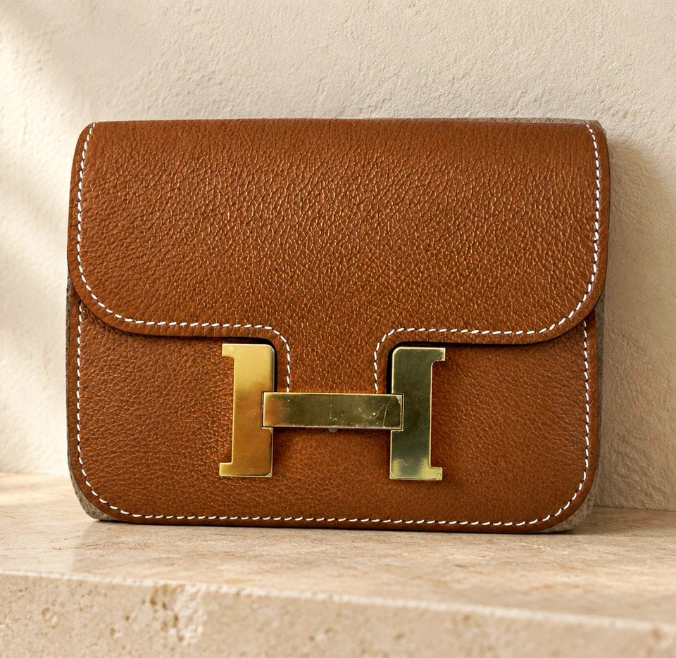 Hermès gold with gold hardware Constance slim wallet